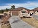 Charming home with a two-car garage, stone accents, and a well-maintained driveway at 24998 E Alder Dr, Aurora, CO 80016