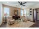 Comfortable living room with neutral tones, plush seating, and ample natural light at 24998 E Alder Dr, Aurora, CO 80016