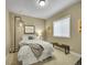 Comfortable bedroom with neutral walls, carpet, and natural light from the window at 10770 Hillrose St, Parker, CO 80134