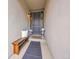 Welcoming entryway with a wooden bench, decorative pillows, and a stylish welcome mat at 10770 Hillrose St, Parker, CO 80134