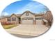 Charming home featuring a three-car garage, stone accents, and neutral stucco exterior at 10770 Hillrose St, Parker, CO 80134