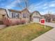 Inviting home with a lush lawn and attractive landscaping at 10770 Hillrose St, Parker, CO 80134