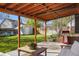Backyard patio and lush lawn with a shed and mature trees at 11446 W 105Th Dr, Broomfield, CO 80021