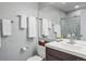 Clean bathroom with a modern vanity, neutral gray wall paint, and a glass-enclosed shower at 11446 W 105Th Dr, Broomfield, CO 80021