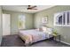 Cozy bedroom featuring ample natural light, a ceiling fan, and neutral walls at 11446 W 105Th Dr, Broomfield, CO 80021