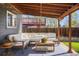 Inviting covered patio with comfortable seating and outdoor rug, great for relaxing at 11446 W 105Th Dr, Broomfield, CO 80021