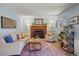 Cozy living room features a fireplace, comfortable seating, and stylish decor at 11446 W 105Th Dr, Broomfield, CO 80021