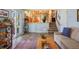 Open-concept living space with hardwood flooring, stairs, and access to the outside through sliding glass doors at 11446 W 105Th Dr, Broomfield, CO 80021