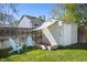 Backyard shed with sand box and Adirondack chairs on a sunny day at 11446 W 105Th Dr, Broomfield, CO 80021