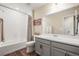 Clean bathroom with a bathtub and vanity at 2866 Low Meadow Blvd, Castle Rock, CO 80109