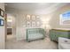 Charming Bedroom featuring a crib and changing table at 2866 Low Meadow Blvd, Castle Rock, CO 80109