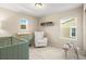 Well-lit Bedroom with a comfortable armchair at 2866 Low Meadow Blvd, Castle Rock, CO 80109