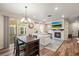 Open concept dining area with kitchen and hardwood floors at 2866 Low Meadow Blvd, Castle Rock, CO 80109