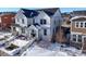 Two-story home with white siding, snowy front yard, and attached garage at 2866 Low Meadow Blvd, Castle Rock, CO 80109