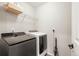 Laundry room with washer, dryer, and shelving at 2866 Low Meadow Blvd, Castle Rock, CO 80109