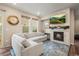 Living room featuring a gas fireplace, sectional sofa, and hardwood floors at 2866 Low Meadow Blvd, Castle Rock, CO 80109