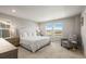 Main bedroom with king-size bed and views from the window at 2866 Low Meadow Blvd, Castle Rock, CO 80109