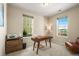 Bright home office with a desk, chair, and window views at 2866 Low Meadow Blvd, Castle Rock, CO 80109