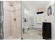 Well-lit bathroom offering a tiled shower, modern fixtures, and neutral colors for a serene atmosphere at 8691 S Warhawk Rd, Conifer, CO 80433