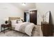Comfortable bedroom with carpet, a well-made bed, and matching dressers, providing a cozy retreat at 8691 S Warhawk Rd, Conifer, CO 80433