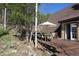 Outdoor deck with dining area, grill, and access to home at 8691 S Warhawk Rd, Conifer, CO 80433