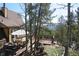 Spacious deck with mountain views, outdoor grill, and dining area at 8691 S Warhawk Rd, Conifer, CO 80433