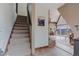 Inviting entryway with staircase leading to living area featuring open floor plan and scenic views at 8691 S Warhawk Rd, Conifer, CO 80433