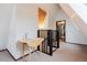 Bright hallway with a folding table and a view of rooms at 8691 S Warhawk Rd, Conifer, CO 80433