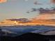 Striking landscape with vibrant sunset over a sea of clouds at 8691 S Warhawk Rd, Conifer, CO 80433