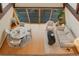 Open living area with modern furnishings, including a round dining table, sofa, and chairs at 8691 S Warhawk Rd, Conifer, CO 80433