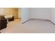 Cozy carpeted living room showcasing the inviting interior and seamless flow to other spaces at 8691 S Warhawk Rd, Conifer, CO 80433