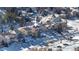 Aerial view of house nestled in a snow covered neighborhood at 110 Oakdale Dr, Palmer Lake, CO 80132