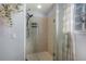 Clean bathroom with a stand-up shower and glass enclosure at 110 Oakdale Dr, Palmer Lake, CO 80133