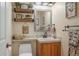 Small bathroom with a corner vanity and toilet at 110 Oakdale Dr, Palmer Lake, CO 80133