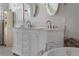 Bathroom with double vanity and marble countertop at 110 Oakdale Dr, Palmer Lake, CO 80132