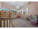 Charming bedroom with a crib and plenty of toys at 110 Oakdale Dr, Palmer Lake, CO 80133