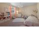 Bright bedroom with a comfy bed and toys at 110 Oakdale Dr, Palmer Lake, CO 80132