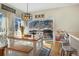 Bright dining area with mountain views and sliding door access to deck at 110 Oakdale Dr, Palmer Lake, CO 80132