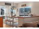 Farmhouse style dining area with mountain views and bench seating at 110 Oakdale Dr, Palmer Lake, CO 80133