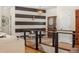 Entryway with a black and white striped accent wall and metal railing at 110 Oakdale Dr, Palmer Lake, CO 80133