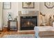 Living room with a gas fireplace and decorative mantel at 110 Oakdale Dr, Palmer Lake, CO 80133