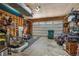 Organized garage with overhead storage and plenty of space at 110 Oakdale Dr, Palmer Lake, CO 80132