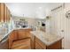 Open kitchen with granite island and views to Gathering room at 110 Oakdale Dr, Palmer Lake, CO 80132