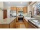 Spacious kitchen featuring granite countertops and modern appliances at 110 Oakdale Dr, Palmer Lake, CO 80133