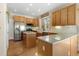 Kitchen with an island, stainless steel appliances, and hardwood floors at 110 Oakdale Dr, Palmer Lake, CO 80132