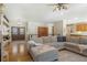 Open living room with hardwood floors and sectional sofa at 110 Oakdale Dr, Palmer Lake, CO 80132