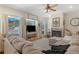 Cozy living room with fireplace, mountain views, and hardwood floors at 110 Oakdale Dr, Palmer Lake, CO 80132