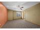 Bedroom with neutral carpeting, a ceiling fan, and large window providing ample natural light at 16185 Willowstone St, Parker, CO 80134