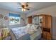 A serene bedroom with a large bed and decorative headboard with plenty of storage at 10640 W 46Th Ave, Wheat Ridge, CO 80033