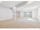 Unfinished basement with neutral carpet and ample natural light ready to be transformed into your dream space at 4046 N Irvington St, Aurora, CO 80019